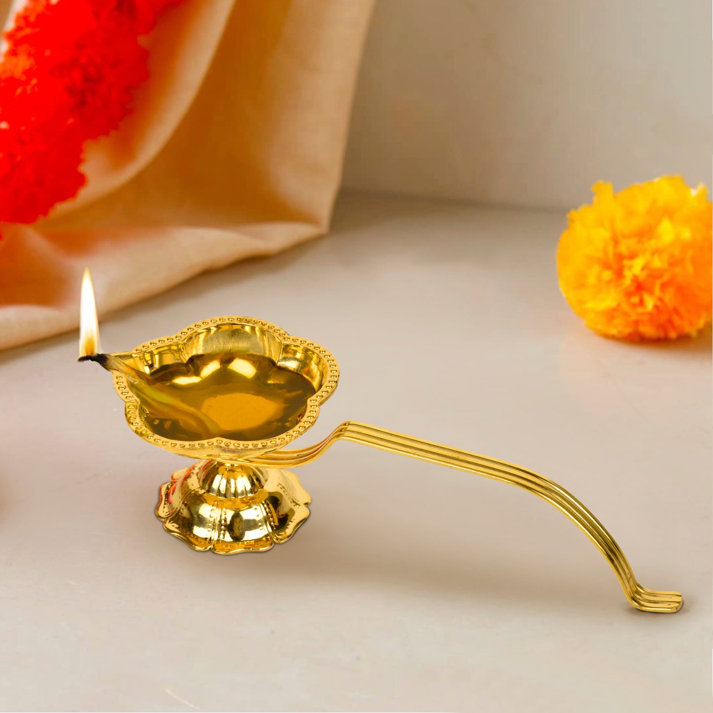Brass Decorative Pooja Aarti Diya with Handle (L x B x H – 20 x 7 x 5.5 cm ; Weight – 140 gm)