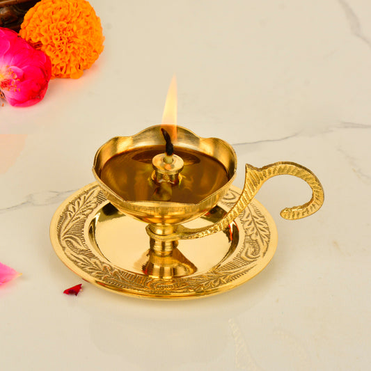 Brass Decorative Pooja Diya with Handle and Plate (L x B x H – 10 x 9 x 5 cm ; Weight – 120 gm)