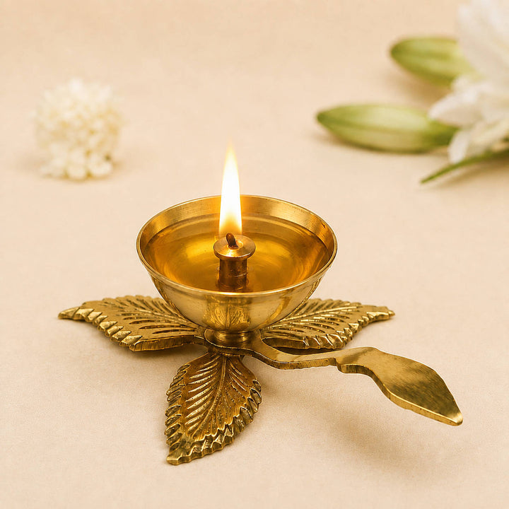 Brass Leaf Design Pooja Aarti Diya with Handle (14 x 10 x 4.5 cm, 110 gm)